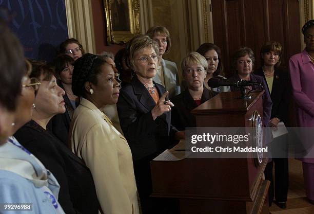 Sen. Barbara Boxer, D-Ca., speaks to fellow women Senators and Representatives before a news conference with the Coalition for a Fair and Independent...