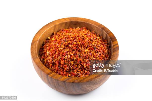 crushed red chili pepper - chilli powder stock-fotos und bilder