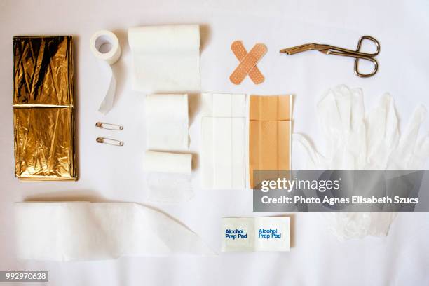 first aid kit with protective gloves - security patch stock pictures, royalty-free photos & images