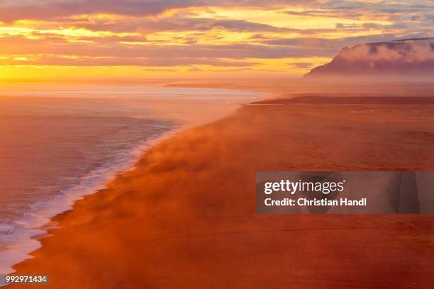 sunset on the south coast, dyrholaey, vik i myrdal, southern region, iceland - south central iceland stock pictures, royalty-free photos & images