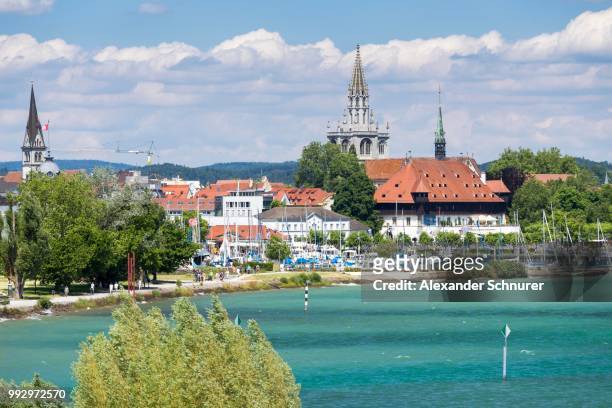 the historic centre of konstanz with the konzilgebaeude building, muenster cathedral and the church of st stephen, konstanz, baden-wuerttemberg, germany - the minster building photos et images de collection
