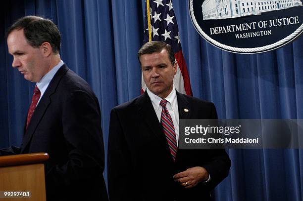 Special Counsel Patrick Fitzgerald and Special Agent John Eckenrode prepare to speak to the press about indictments from a CIA leak at the Department...