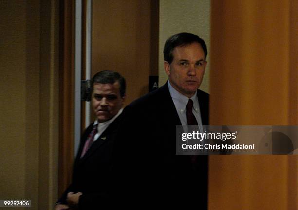 Special Counsel Patrick Fitzgerald and Special Agent John Eckenrode prepare to speak to the press about indictments from a CIA leak at the Department...