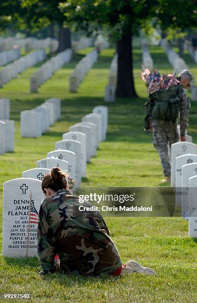 Kristin Kenney, from Edison, NJ, visits the grave of her boyfriend, Dennis Flanagan, an Army sergeant killed this January in Iraq, at Arlington...