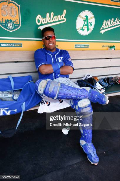 Salvador Perez of the Kansas City Royals relaxes in the dugout prior to the game against the Oakland Athletics at the Oakland Alameda Coliseum on...