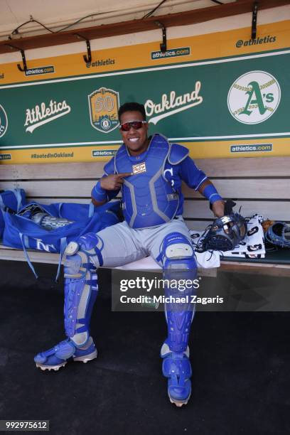 Salvador Perez of the Kansas City Royals relaxes in the dugout prior to the game against the Oakland Athletics at the Oakland Alameda Coliseum on...