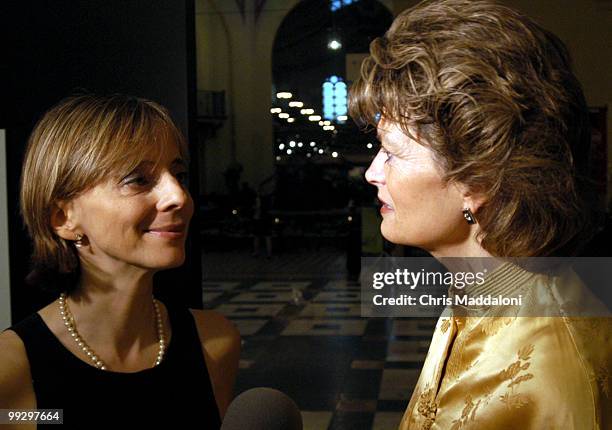 Photojournalist Melina Mara talks with Sen. Lisa Murkowski, R-Ak., at the opening of her photo exhibit "Changing the Face of Power" in the...