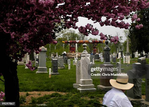 Richard Schlapia, from Washington, DC, watches the U.S. Navy Sea Chanters perform at the dedication ceremony of Lummi totem poles for the 9/11...
