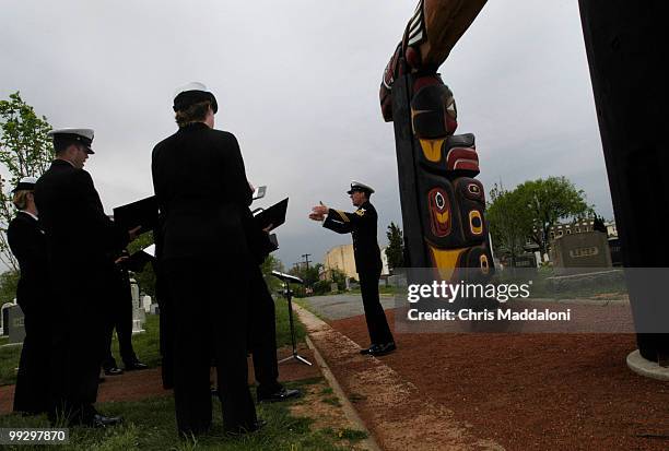 The U.S. Navy Sea Chanters perform at the dedication ceremony of Lummi totem poles for the 9/11 Memorial Grove in the Congressional National Cemetery.