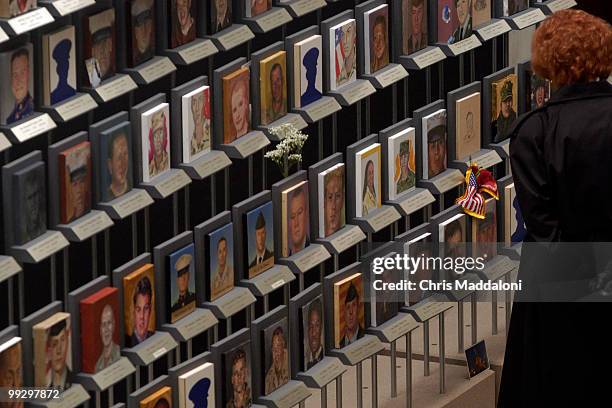 Beverly Ulmer, from Arlington, Tx., at the "Faces of the Fallen" at Arlington National Cemetery. It shows the faces of the 1,322 American soldiers...