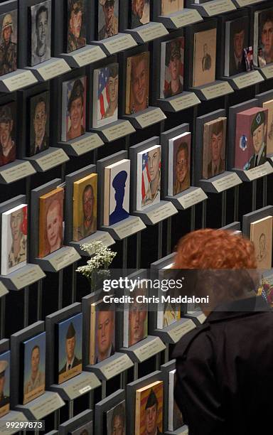 Beverly Ulmer, from Arlington, Tx., at the "Faces of the Fallen" at Arlington National Cemetery. It shows the faces of the 1,322 American soldiers...