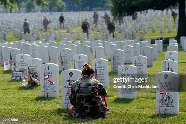 Kristin Kenney, from Edison, NJ, visits the grave of her boyfriend, Dennis Flanagan, an Army sergeant killed this January in Iraq, at Arlington...