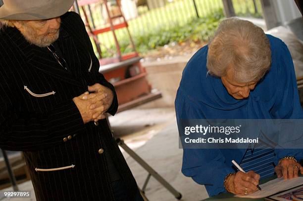 Country singer Merle Haggard and his sister Liilian at the Smithsonian Museum of American History. They are signing documents to donate family items...