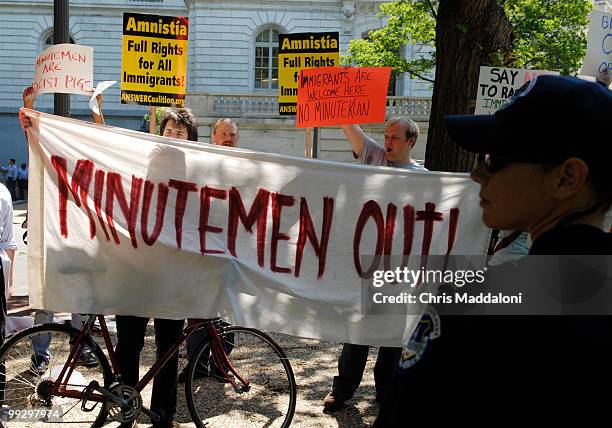 Anti-Minutemen protesters shout during a rally with Jim Gilchrist, founder of the Minuteman Project, to "Stop the Illegal Alien Guest Worker Amnesty...