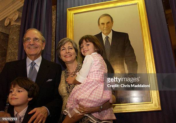 Fmr. Sen. George Mitchell, D-Me., with his wife Heather, daughter Claire, and son Andrew, at his portrait unveiling in the Old Senate Chamber.