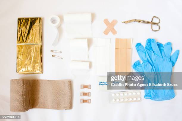 first aid kit with compression bandage - flat lay stock-fotos und bilder