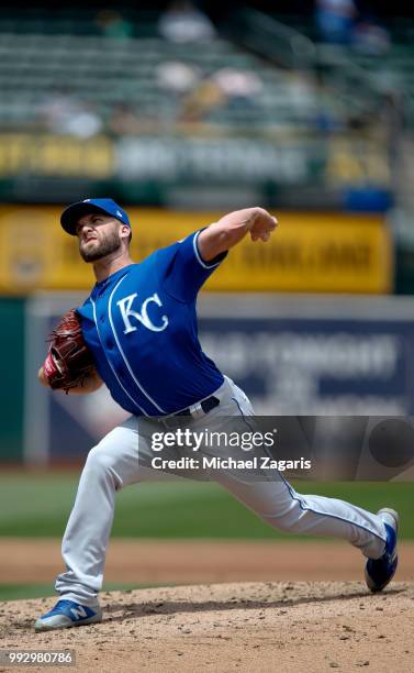 Danny Duffy of the Kansas City Royals pitches during the game against the Oakland Athletics at the Oakland Alameda Coliseum on June 9, 2018 in...