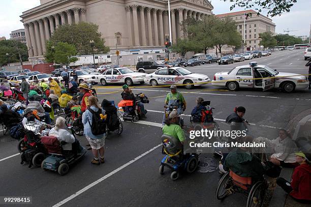 More than 100 protesters, most of them disabled and members of Adapt, an organization for disabled rights, blocked the 800 block of Constitution Ave...