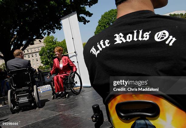 Rep. Jim Langevin , D-RI, speaks with Betheny Winkler , a United 2 Fight Paralysis co-founder, at a Christopher Reeve Foundation "Working 2 Walk...