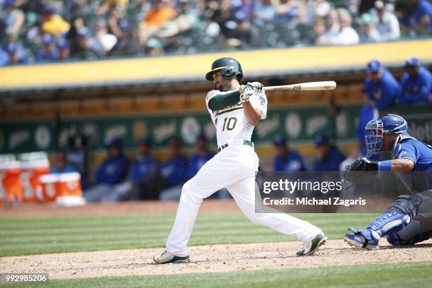 Marcus Semien of the Oakland Athletics bats during the game against the Kansas City Royals at the Oakland Alameda Coliseum on June 9, 2018 in...