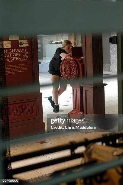 Janet Palestino, visitng from New Jersey, looks at mail delivery displays at the National Postal Museum.