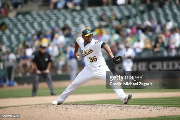 Yusmeiro Petit of the Oakland Athletics pitches during the game against the Kansas City Royals at the Oakland Alameda Coliseum on June 9, 2018 in...