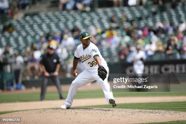 Yusmeiro Petit of the Oakland Athletics pitches during the game against the Kansas City Royals at the Oakland Alameda Coliseum on June 9, 2018 in...