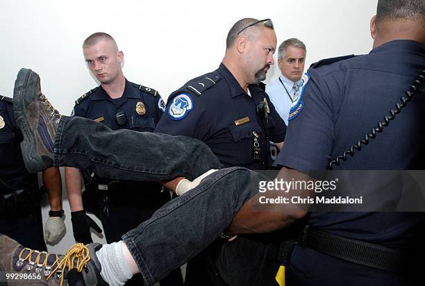 Police carry away protesters from Rep. Joe Barton's office in Rayburn. Members of the American Disabled for Attendant Programs Today held protests...
