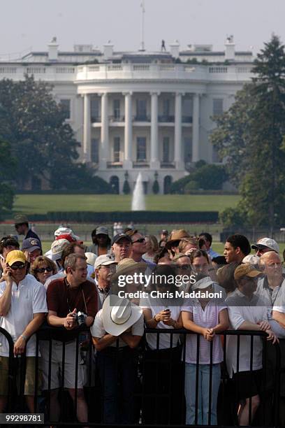 Crowds watch the 3rd Infantry Division Old Guard transfer former President Ronald Reagan's casket to a horse-drawn caisson to take him to to lie in...