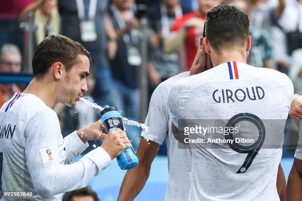 Antoine Griezmann of France splits water during 2018 FIFA World Cup Quarter Final match between France and Uruguay at Nizhniy Novgorod Stadium on...