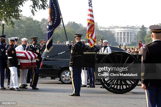 The 3rd Infantry Division Old Guard transfers former President Ronald Reagan's casket to a horse-drawn caisson to take him to to lie in state in the...