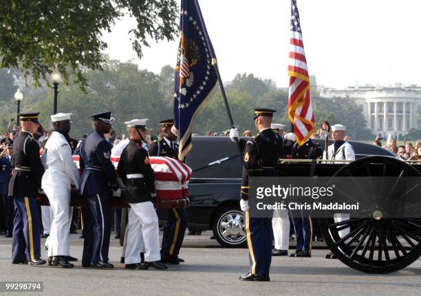 The 3rd Infantry Division Old Guard transfers former President Ronald Reagan's casket to a horse-drawn caisson to take him to to lie in state in the...