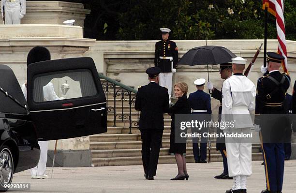 Nancy Reagan takes one last look as the casket of former president Ronald Reagan is removed from lying in state in the Rotunda of the Capitol.