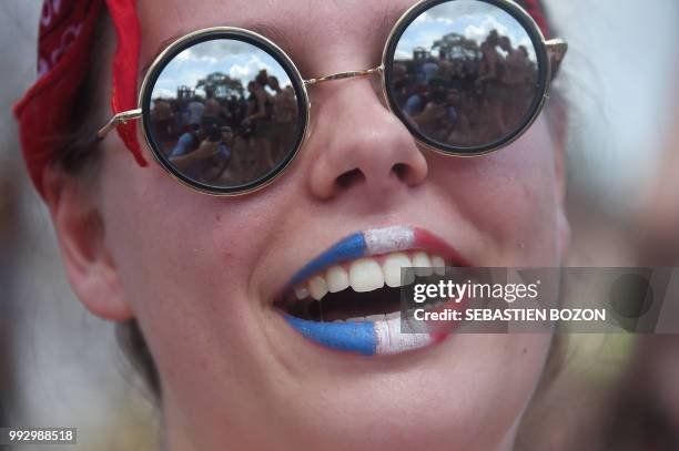 Supporter watches the Russia 2018 World Cup quarter-final football match between Uruguay and France at the Eurockeenes camping during the 30th...