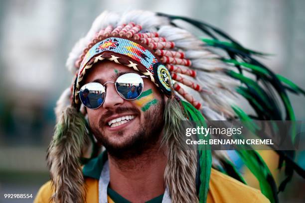 Brazil fan cheers before the Russia 2018 World Cup quarter-final football match between Brazil and Belgium at the Kazan Arena in Kazan on July 6,...