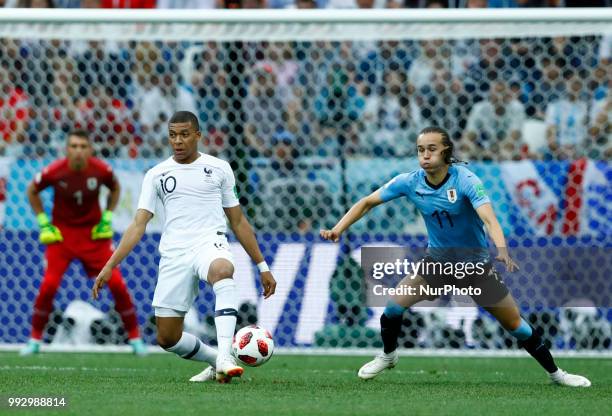 France v Uruguay - Quarter-finals FIFA World Cup Russia 2018 Kylian Mbappe and Diego Laxalt at Nizhny Novgorod Stadium in Russia on July 6, 2018.