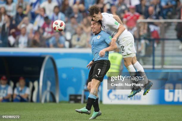 Cristian Rodriguez ,Benjamin Pavard during France v Uruguay - Quarter-finals FIFA World Cup Russia 2018 at Nizhny Novgorod Stadium in Russia on July...