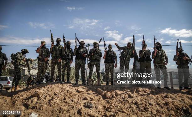 Dpatop - Members of the Palestinian Islamic Jihad Movement attend a funeral of militants killed in an Israeli operation to blow up a tunnel...