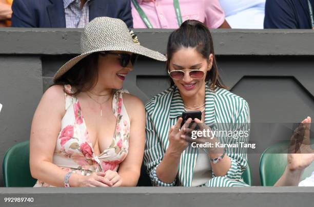 Cara McConnell and Olivia Munn attend day five of the Wimbledon Tennis Championships at the All England Lawn Tennis and Croquet Club on July 6, 2018...