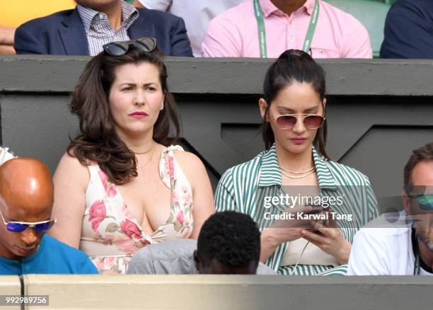 Cara McConnell and Olivia Munn attend day five of the Wimbledon Tennis Championships at the All England Lawn Tennis and Croquet Club on July 6, 2018...