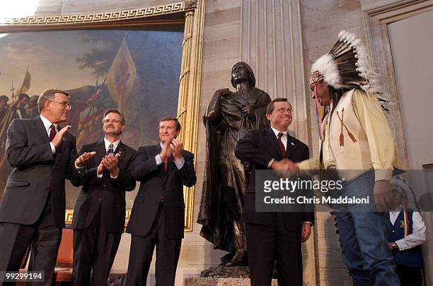 Tex Hall, Chairman, Mandan, Hidatsa and Arikara Nation, , shakes hands with Rep. Earl Pomeroy, D-ND, after the Sakakawea Statue dedication....