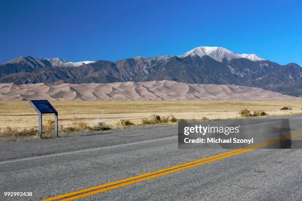 street, behind the sangre de cristo mountains, great sand dunes national park and preserve, colorado, united states - sangre stock pictures, royalty-free photos & images