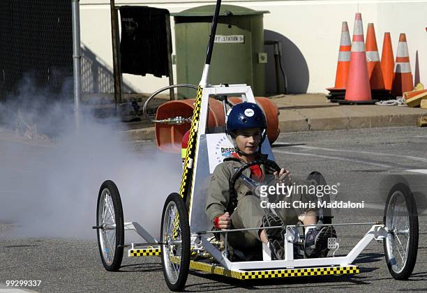 Ryan Lee from Hamilotn, Ohio, drives a cart propelled by fire extinguishers at the Discovery Channel Young Scientist Challenge 2003. Middle school...