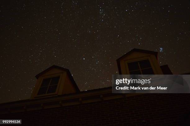 house with stars - meer stock pictures, royalty-free photos & images