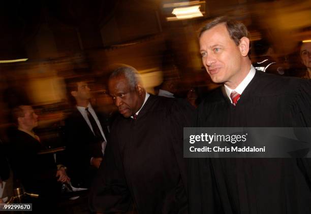 Supreme Court Judges Clarence Thomas and John Roberts enter the chamber of the House of Representatives before President Bush's 2006 State of the...