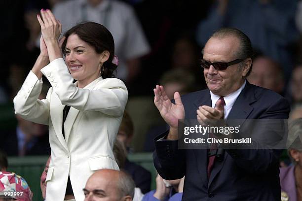 Jack Nicholson and Lara Flyn Boyle cheer Goran Ivanisevic of Croatia win over Patrick Rafter of Australia during the Men's Final of The All England...