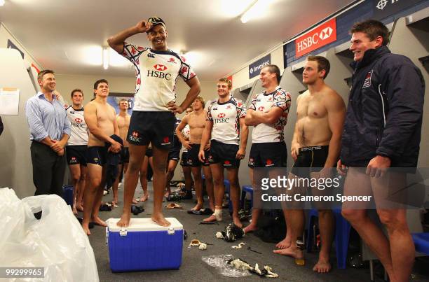 Kurtley Beale of the Waratahs receives his 50th cap for the Waratahs after winning the 14 Super 14 match between the Waratahs and the Hurricanes at...