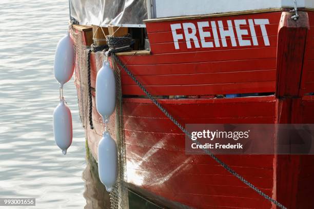 red bow of the fishing boat named --freiheit--, mecklenburg-western pomerania, germany - freiheit fotografías e imágenes de stock