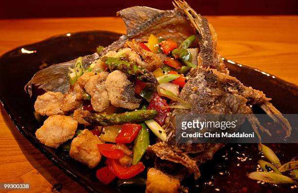 Chef Richard Sandoval's "Crispy Whole Striped Bass with Chile Ancho, Asparagus, Guajillo Hot and Sour Sauce" at the new fusion restaurant in...