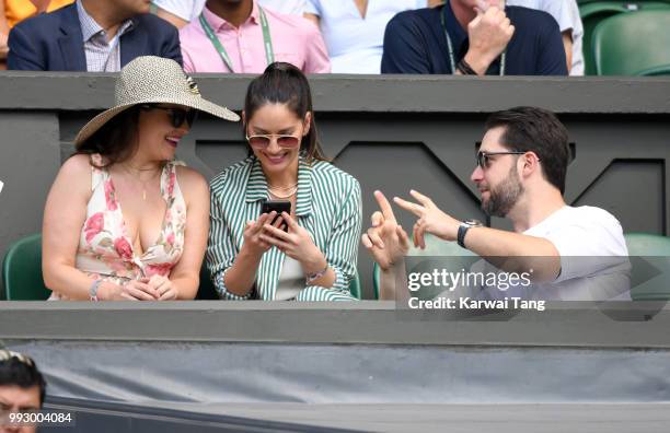 Cara McConnell, Olivia Munn and Alexis Ohanian attend day five of the Wimbledon Tennis Championships at the All England Lawn Tennis and Croquet Club...